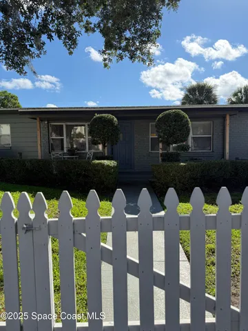 a front view of a house with yard
