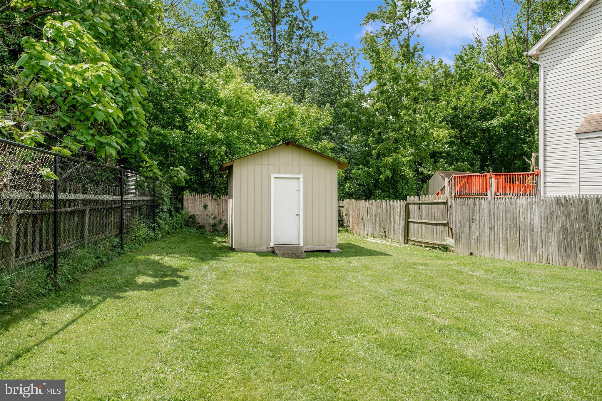 713 Seek Lane Silver Spring, MD 20912 - Photo 48 of 60 a house is sitting in middle of the green field