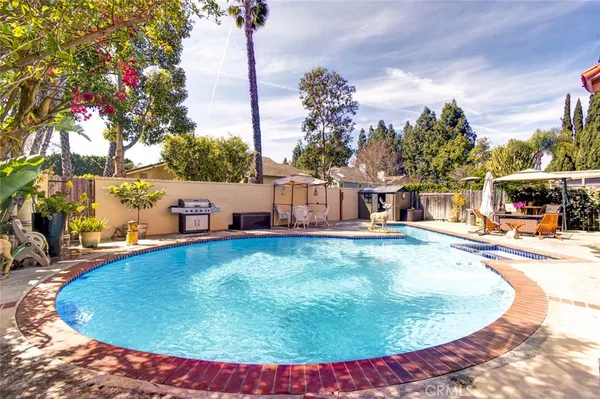 a view of a swimming pool with an outdoor seating