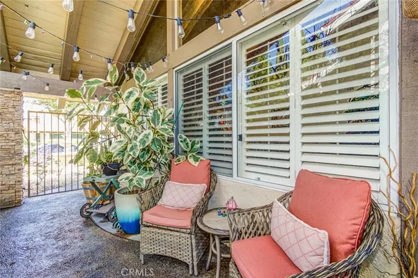 a outdoor living space with furniture and a potted plant