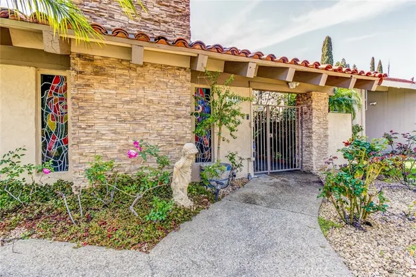 a front view of a building with flowers