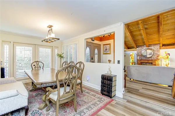 a living room with furniture a window and a chandelier