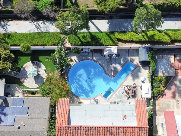 an aerial view of a house with outdoor space