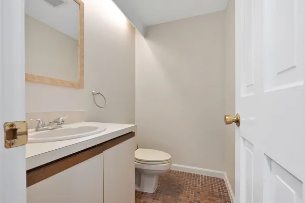 a bathroom with a toilet and a sink