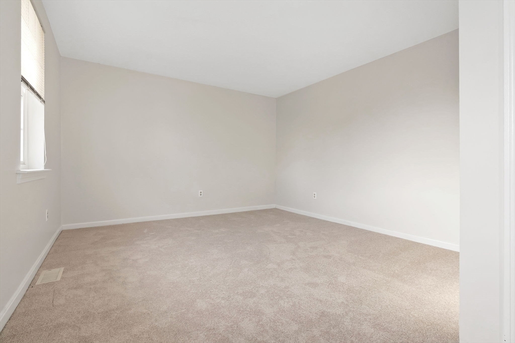 320 Newbury Street, Unit 304 Danvers, MA 01923 - Photo 25 of 32 an empty room with a window