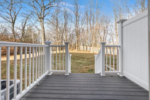 a view of a room with wooden floor and fence