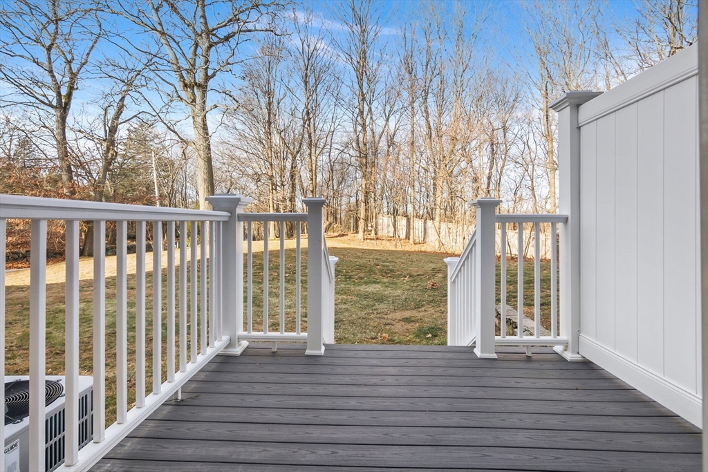 320 Newbury Street, Unit 304 Danvers, MA 01923 - Photo 29 of 32 a view of balcony with wooden floor and fence