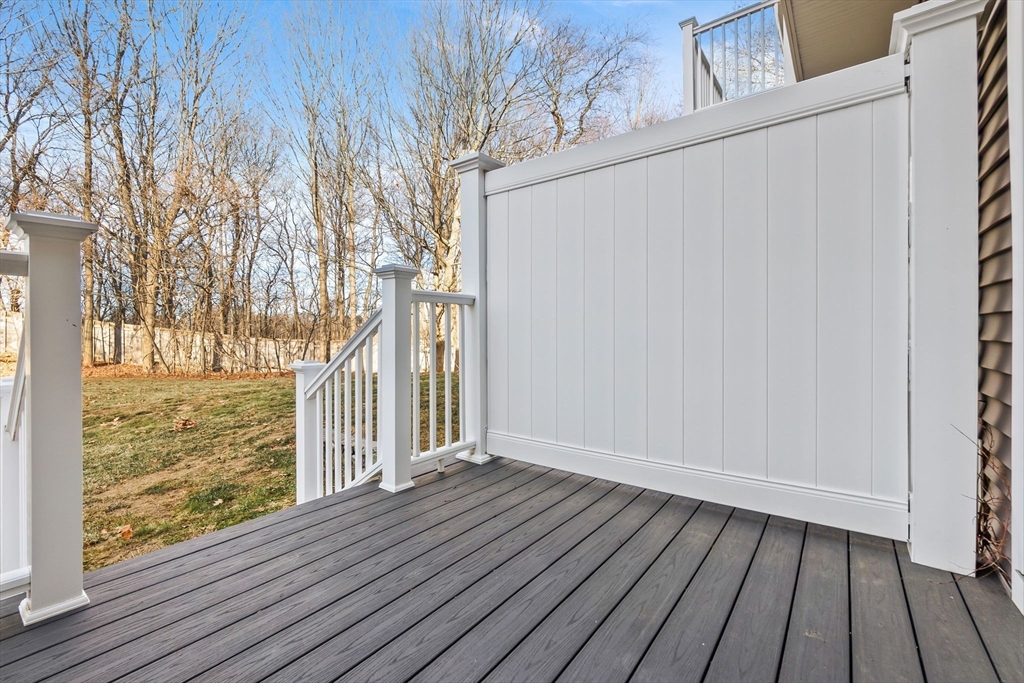 320 Newbury Street, Unit 304 Danvers, MA 01923 - Photo 30 of 32 a view of a room with wooden floor and fence