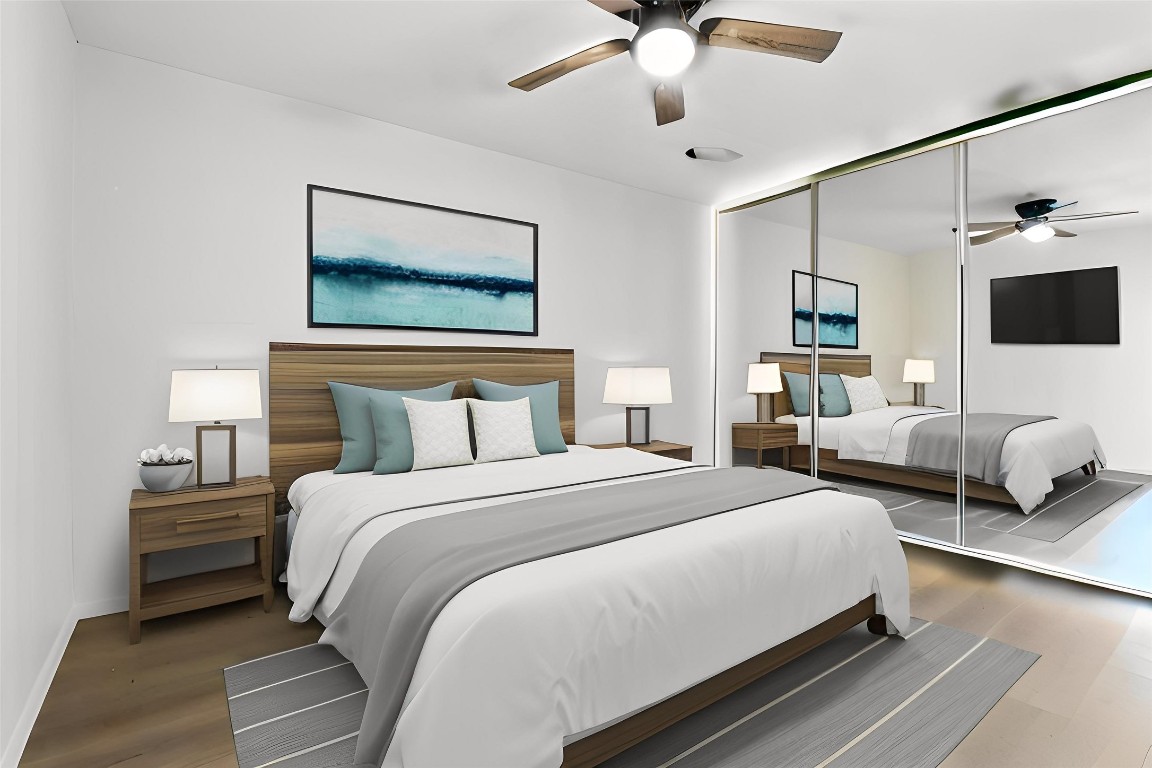 a bedroom with bed and a chandelier