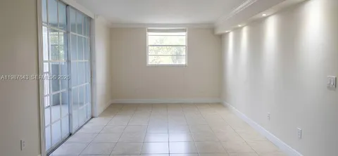 a living room with furniture and window