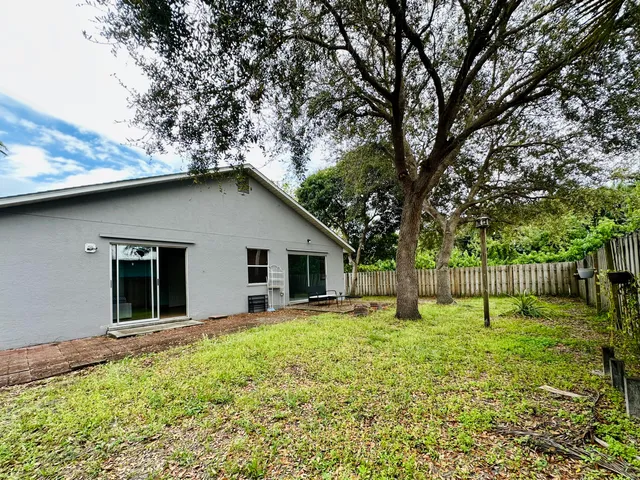 a house with trees in the background