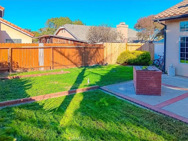 a view of a backyard with a garden and plants