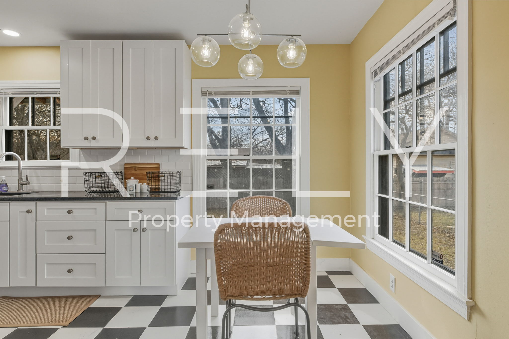 933 East 56th 1/2 Street Austin, TX 78751 - Photo 14 of 37 a kitchen with stainless steel appliances granite countertop a stove a sink and a chandelier