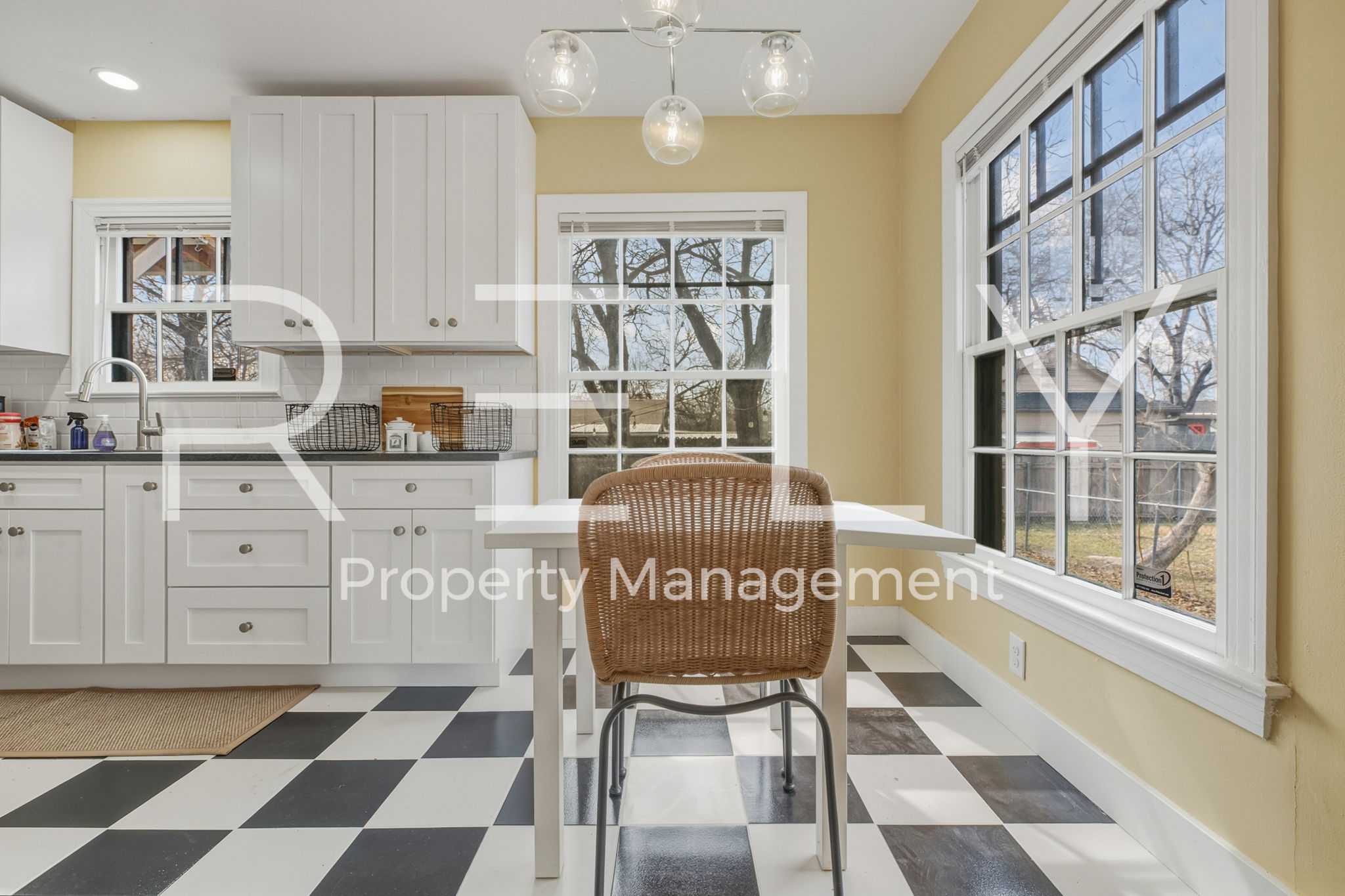933 East 56th 1/2 Street Austin, TX 78751 - Photo 15 of 37 a kitchen with a stove a sink and a dining table chair