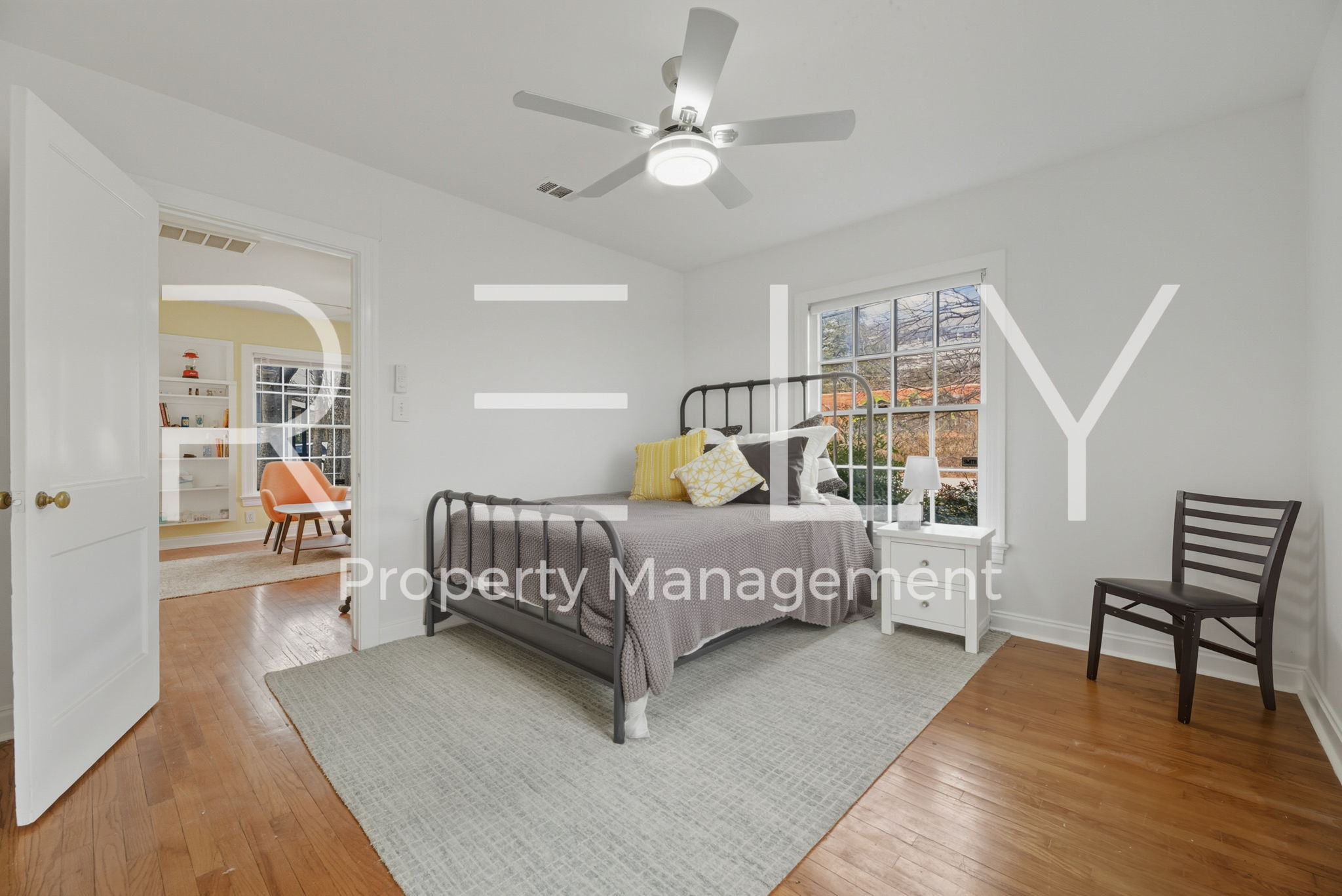 933 East 56th 1/2 Street Austin, TX 78751 - Photo 26 of 37 a bedroom with a bed and a table in it