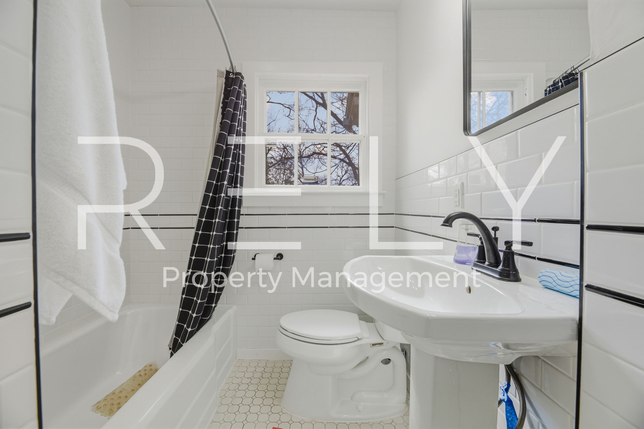 933 East 56th 1/2 Street Austin, TX 78751 - Photo 28 of 37 a bathroom with a sink a toilet and shower