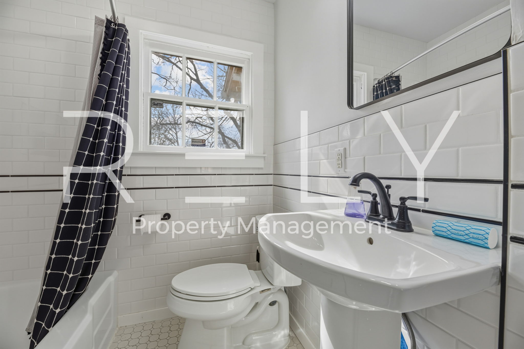 933 East 56th 1/2 Street Austin, TX 78751 - Photo 29 of 37 a bathroom with a sink toilet and shower