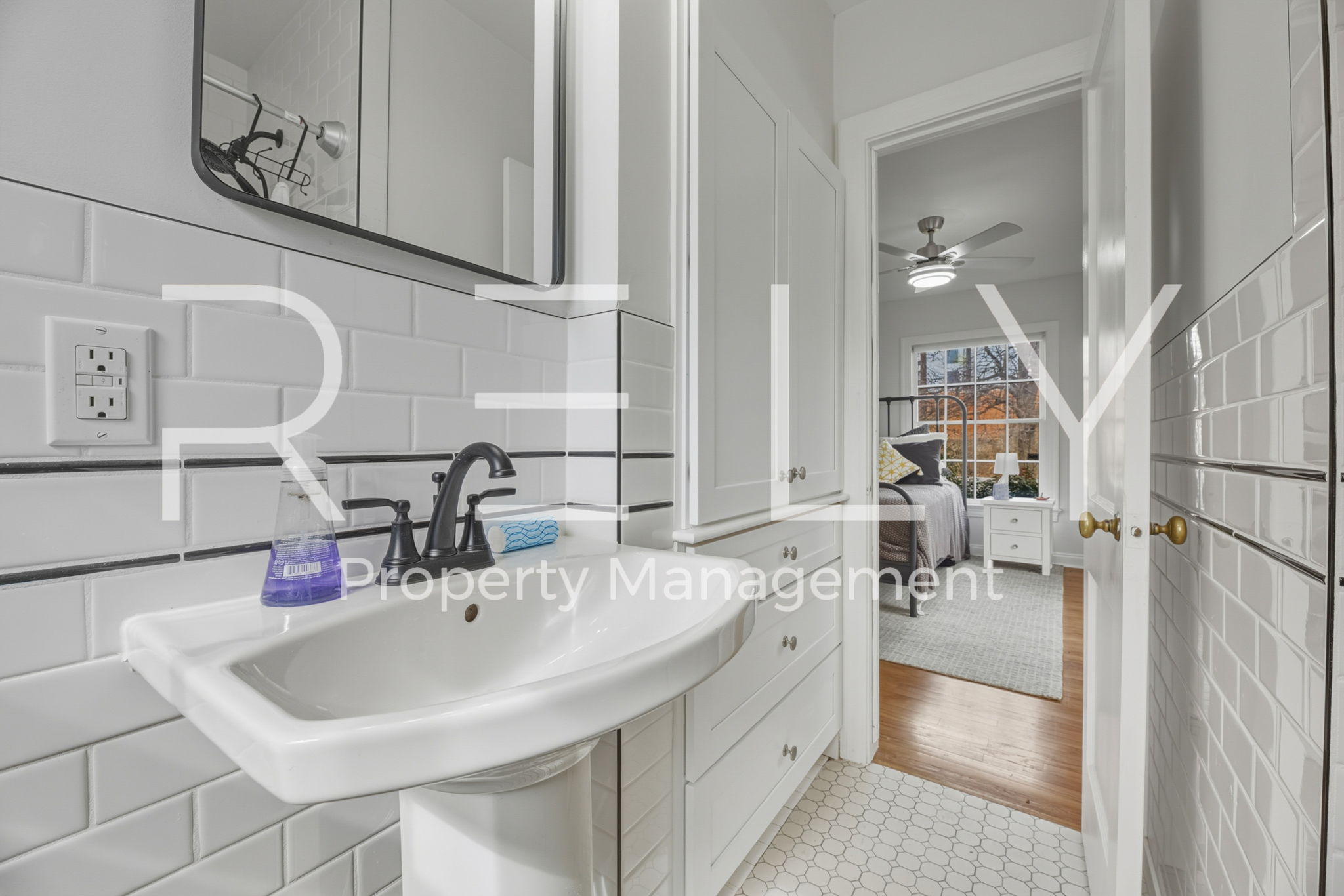 933 East 56th 1/2 Street Austin, TX 78751 - Photo 31 of 37 a bathroom with a sink and a mirror