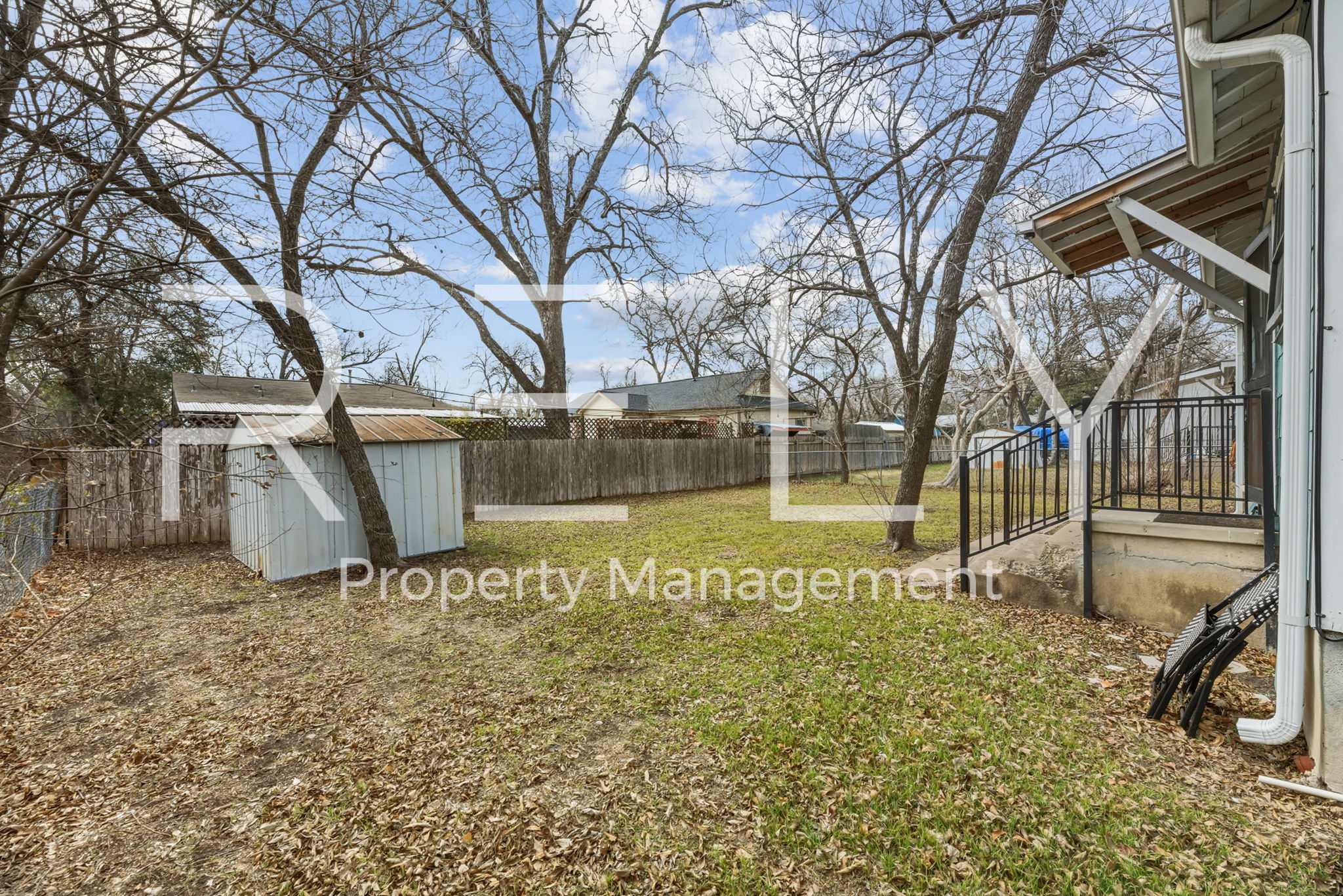 933 East 56th 1/2 Street Austin, TX 78751 - Photo 33 of 37 a view of a yard with a tree