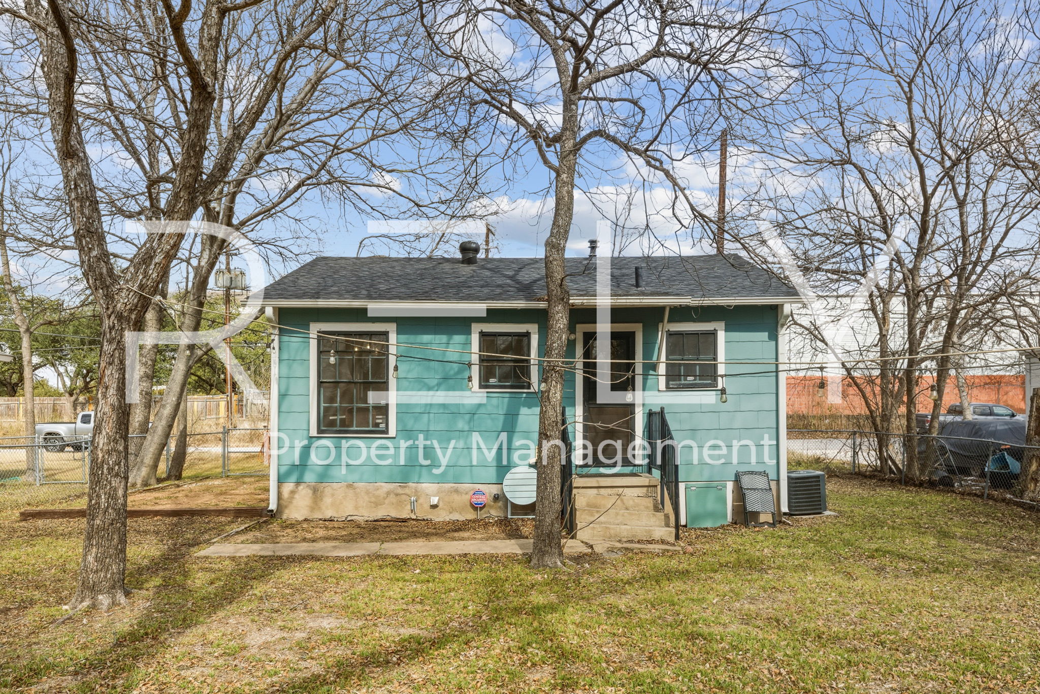 933 East 56th 1/2 Street Austin, TX 78751 - Photo 35 of 37 a view of a house with a yard covered in snow