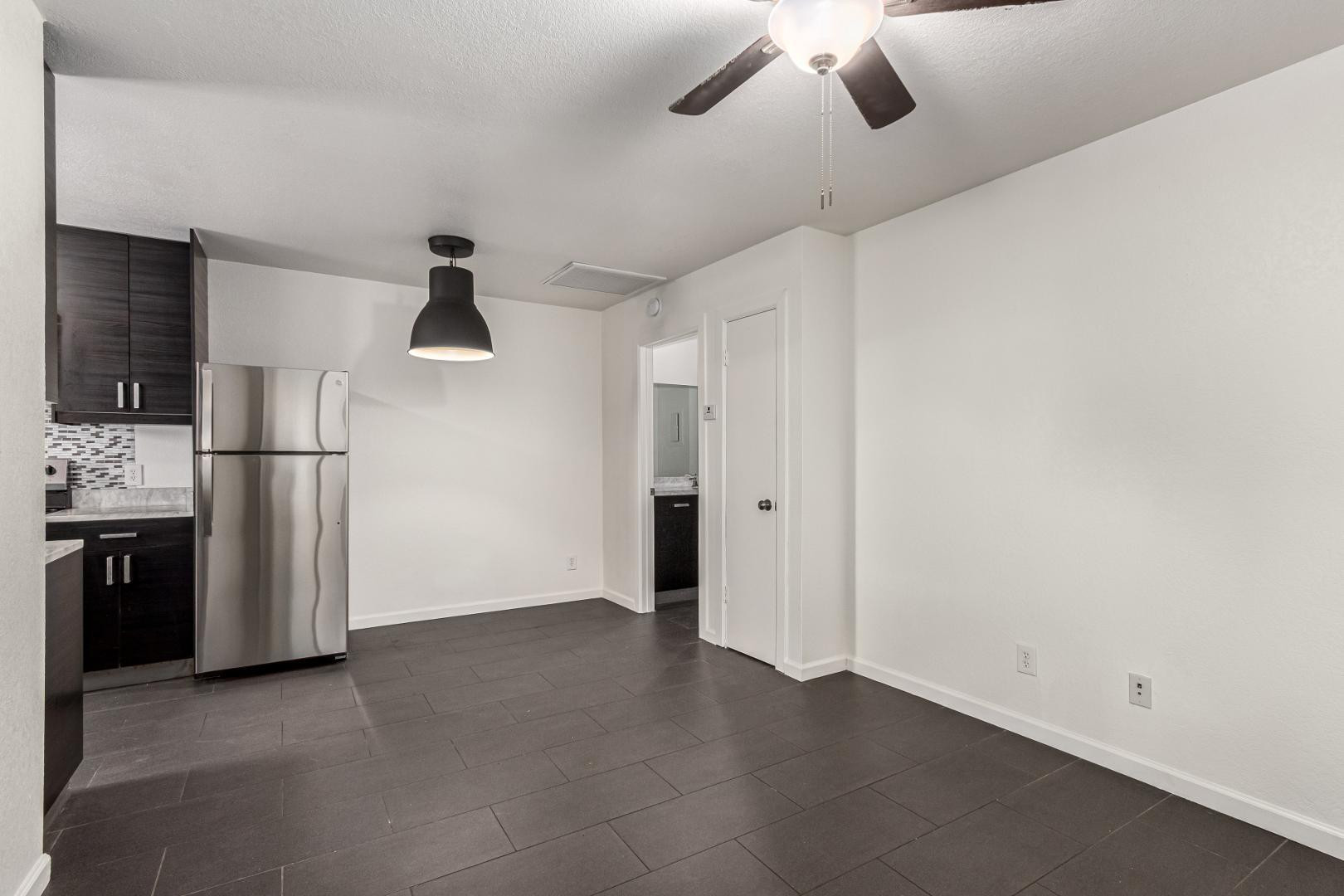 3034 North 35th Street, Unit 3 Phoenix, AZ 85018 - Photo 3 of 10 a view of a kitchen with a refrigerator a microwave and a refrigerator
