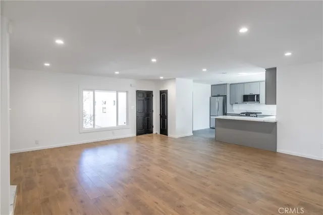 a view of an empty room with a fireplace