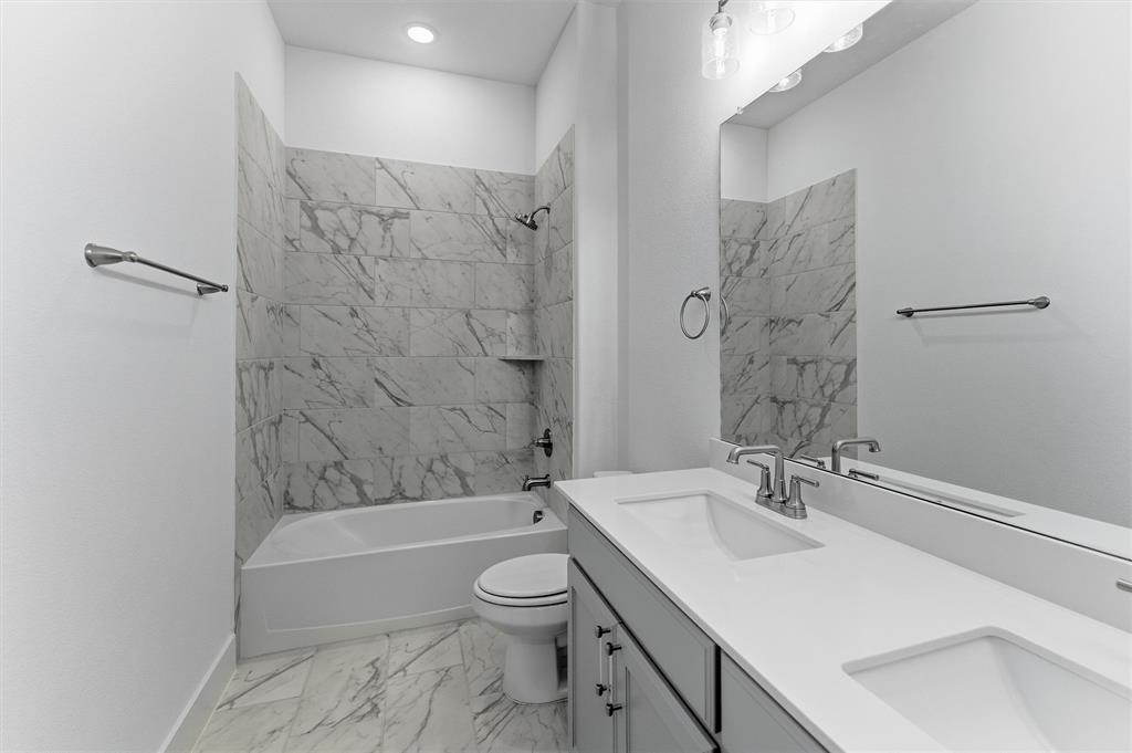 906 Perrin Lane Van Alstyne, TX 75495 - Photo 18 of 30 a bathroom with a sink toilet and shower