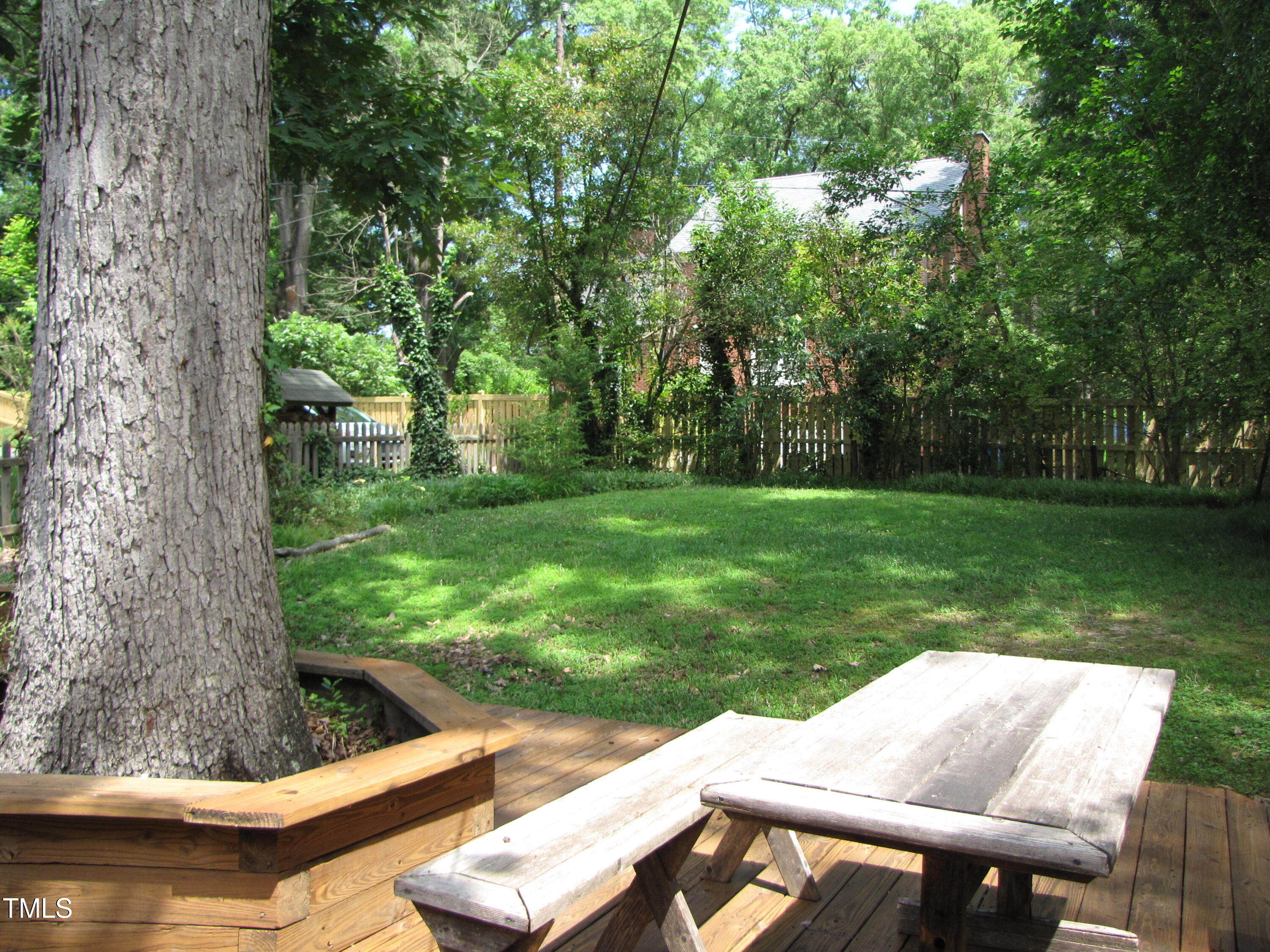 1024 Starlight Drive Durham, NC 27707 - Photo 16 of 18 a view of backyard with seating area and trees