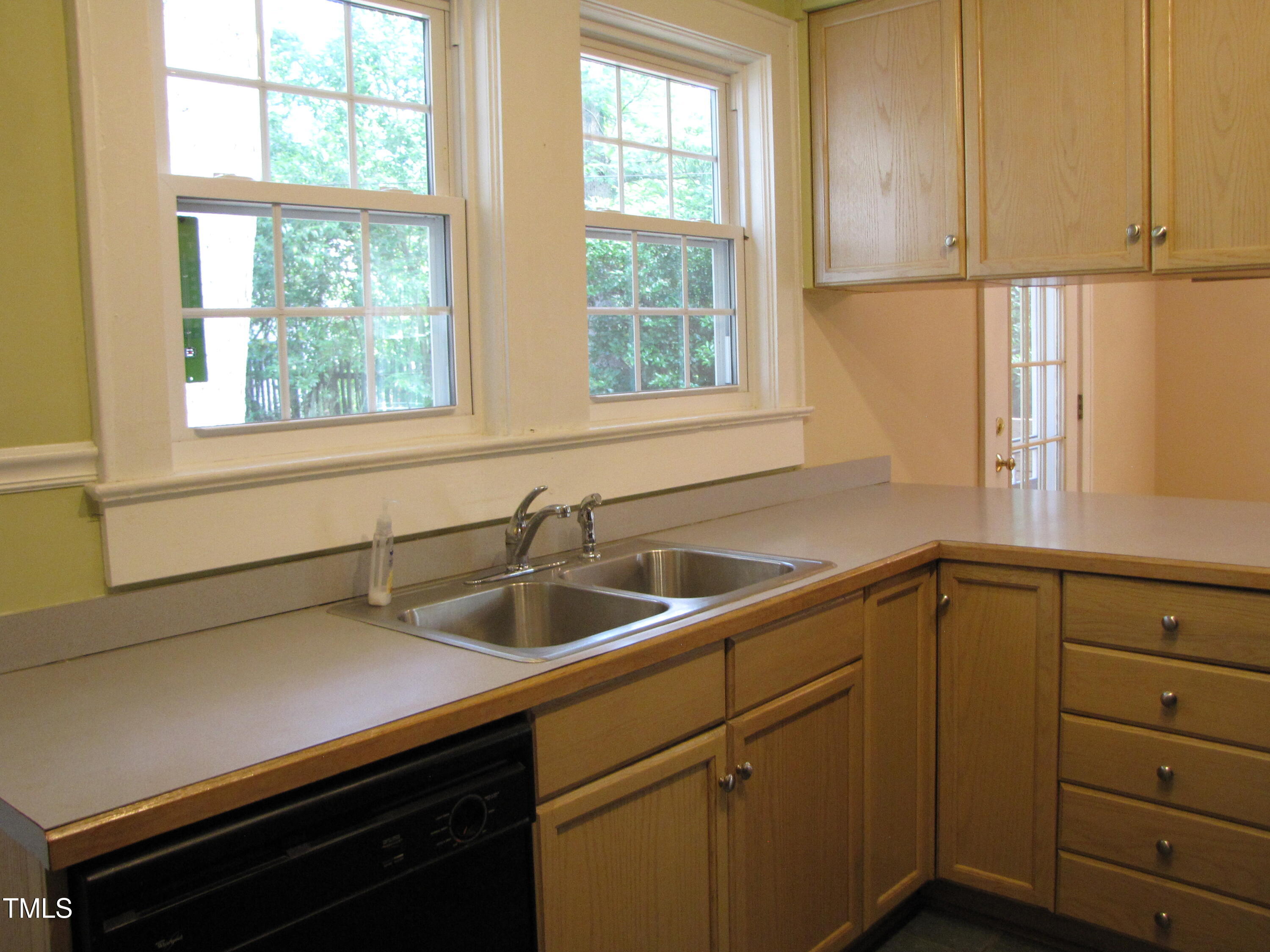 1024 Starlight Drive Durham, NC 27707 - Photo 6 of 18 a kitchen with a sink and windows