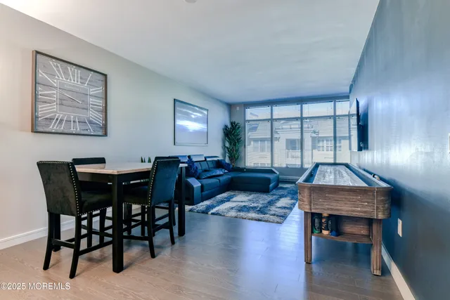 a living room with furniture a window and a table