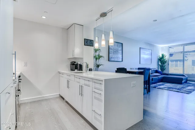a spacious kitchen with stainless steel appliances granite countertop a sink and cabinets