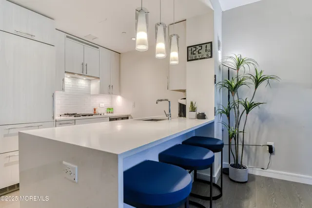 a view of a kitchen with a table and chairs