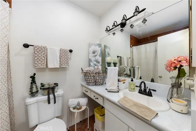 a bathroom with a sink a vanity and mirror