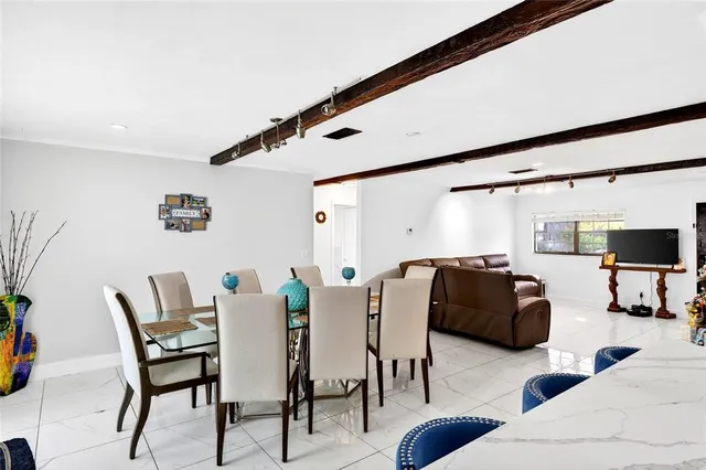 a view of a livingroom with furniture and lounge chair