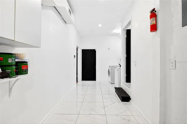 a living room with fireplace furniture and a flat screen tv