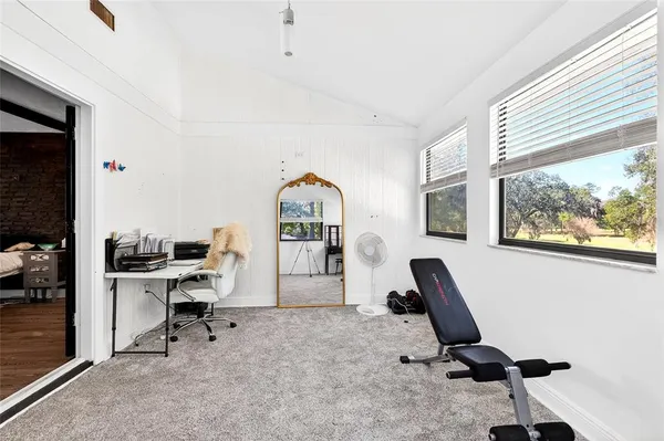 a workspace with furniture and windows