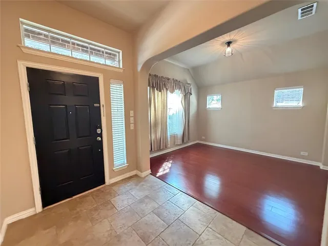 a view of gallery with wooden floor