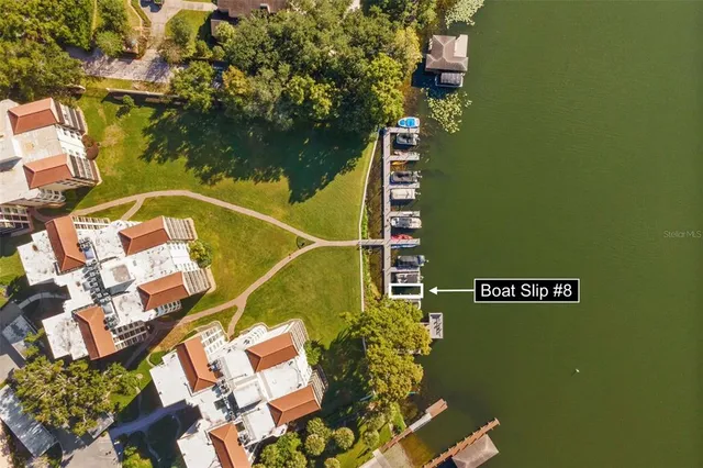 an aerial view of a house with a swimming pool