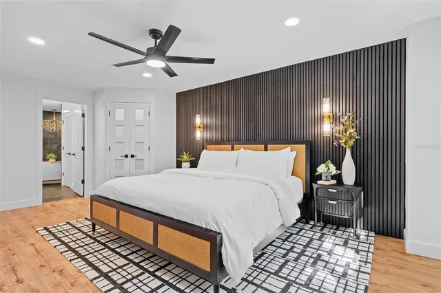 a bedroom with a bed and a walk in closet