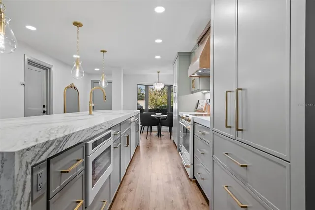 a bathroom with a granite countertop double vanity and a sink