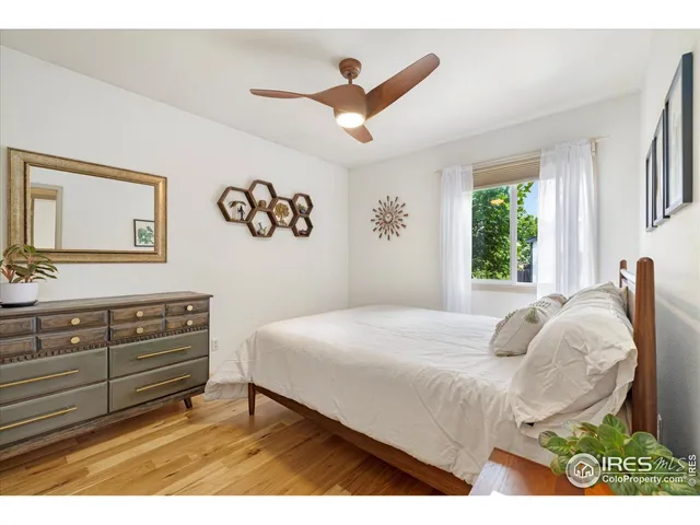 a bedroom with a bed and a table