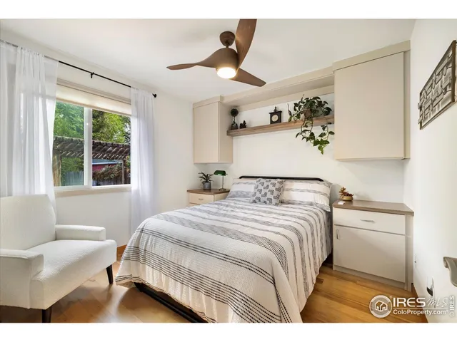 a spacious bedroom with a bed and a window