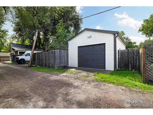 a backyard of a house with yard and garage