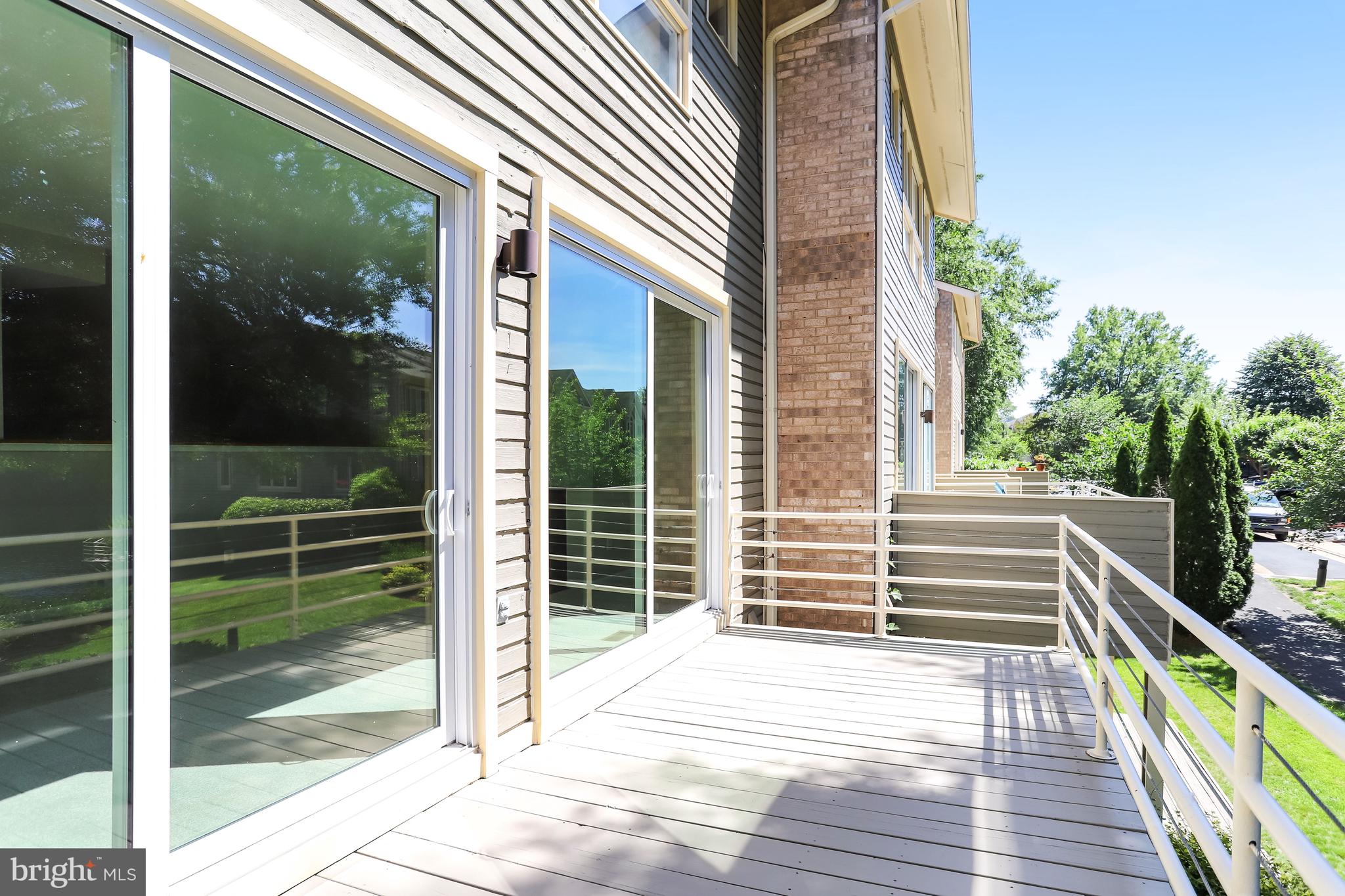 1953 Lakeport Way Reston, VA 20191 - Photo 49 of 60 a view of a balcony with floor to ceiling windows