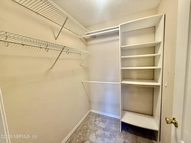 a view of an empty walk in closet