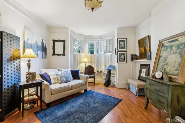 a view of living room and dining room with furniture