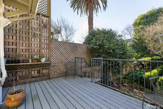 a bedroom with furniture and a flat screen tv