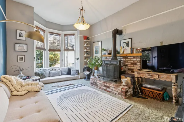 a view of a livingroom with furniture and a flat screen tv