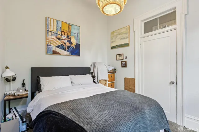 a view of a dining room with furniture and a window