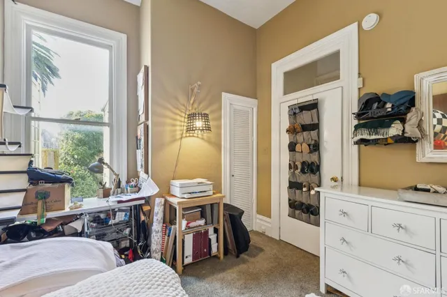 a view of a dining room with furniture and a window
